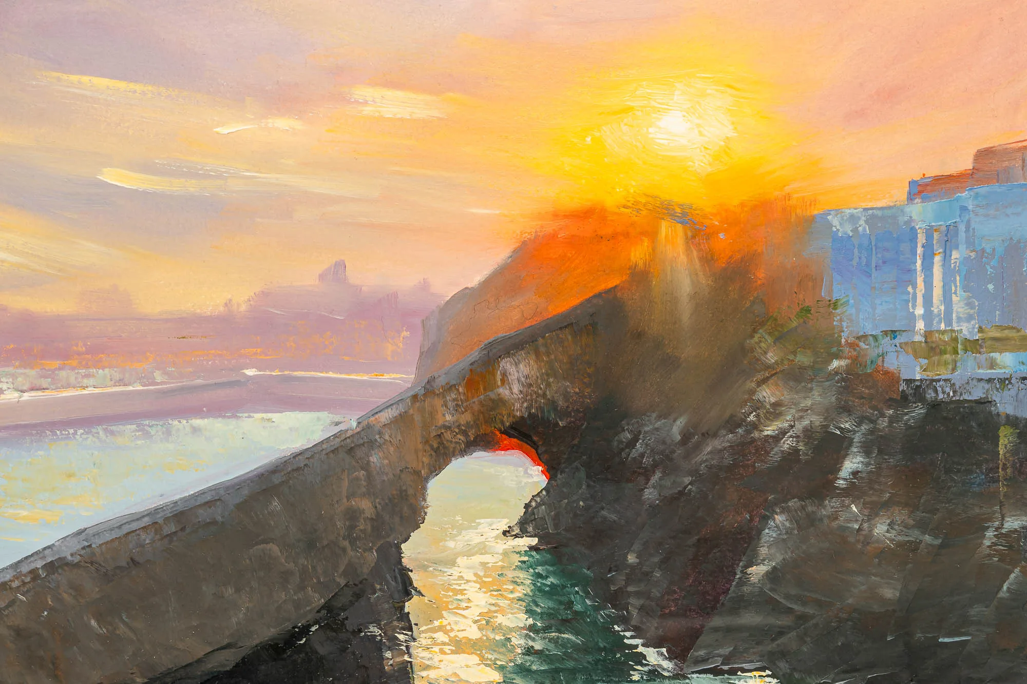 Close-up of Last Light in Biarritz, an original oil painting: a low sun glows over a rocky arch and a pale blue building above the sea, with thick, textured brushwork.