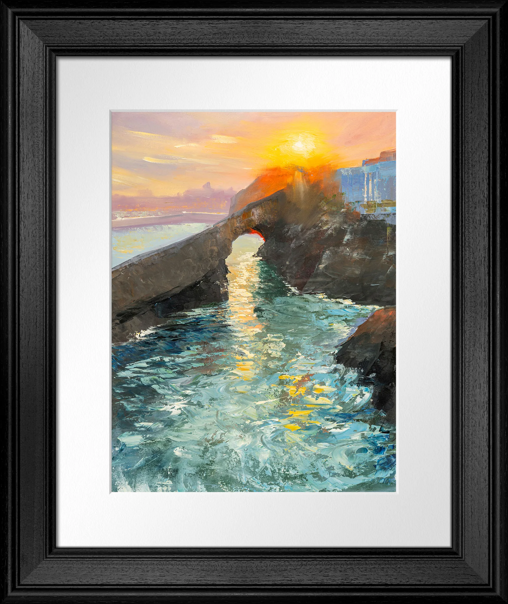 Last Light in Biarritz, an original oil painting by Paul Kenton in a black frame with a white mount: a rocky sea arch at sunset, with a glowing orange sun, golden reflections on turquoise waves and a pastel sky.
