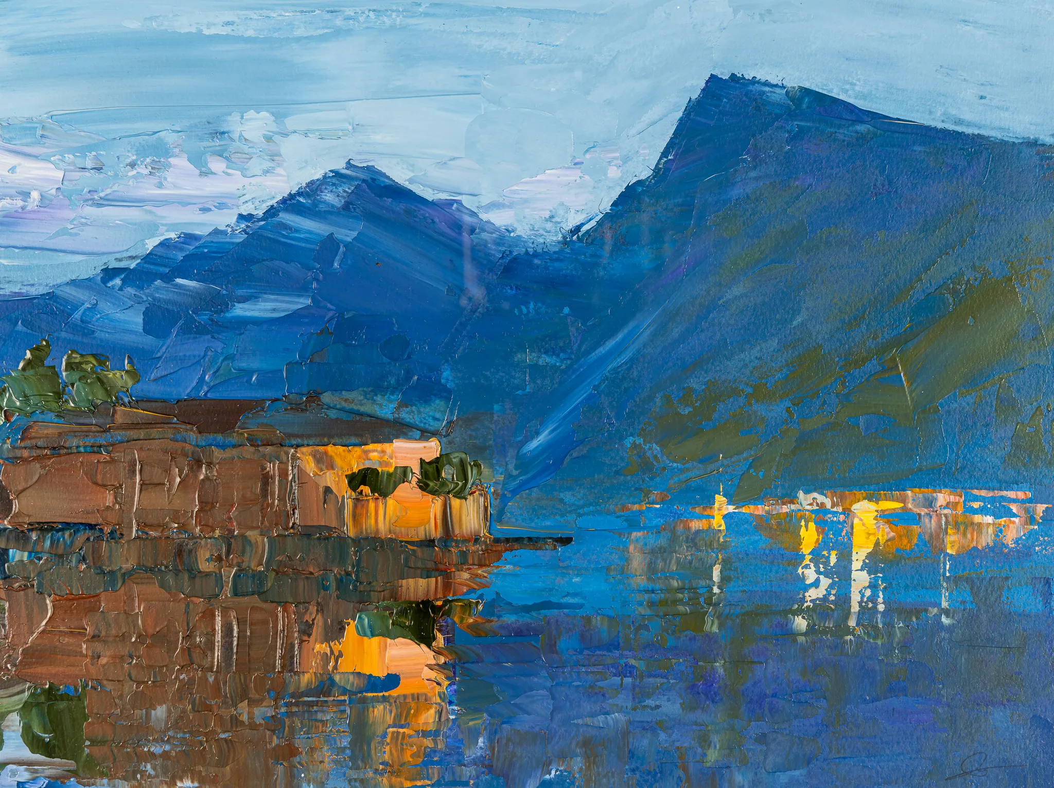 Sapphire Reflections, an original painting by Paul Kenton: thickly textured blue mountains rise over a lake, where a brown lakeside building glows with warm light and reflects in the still water.