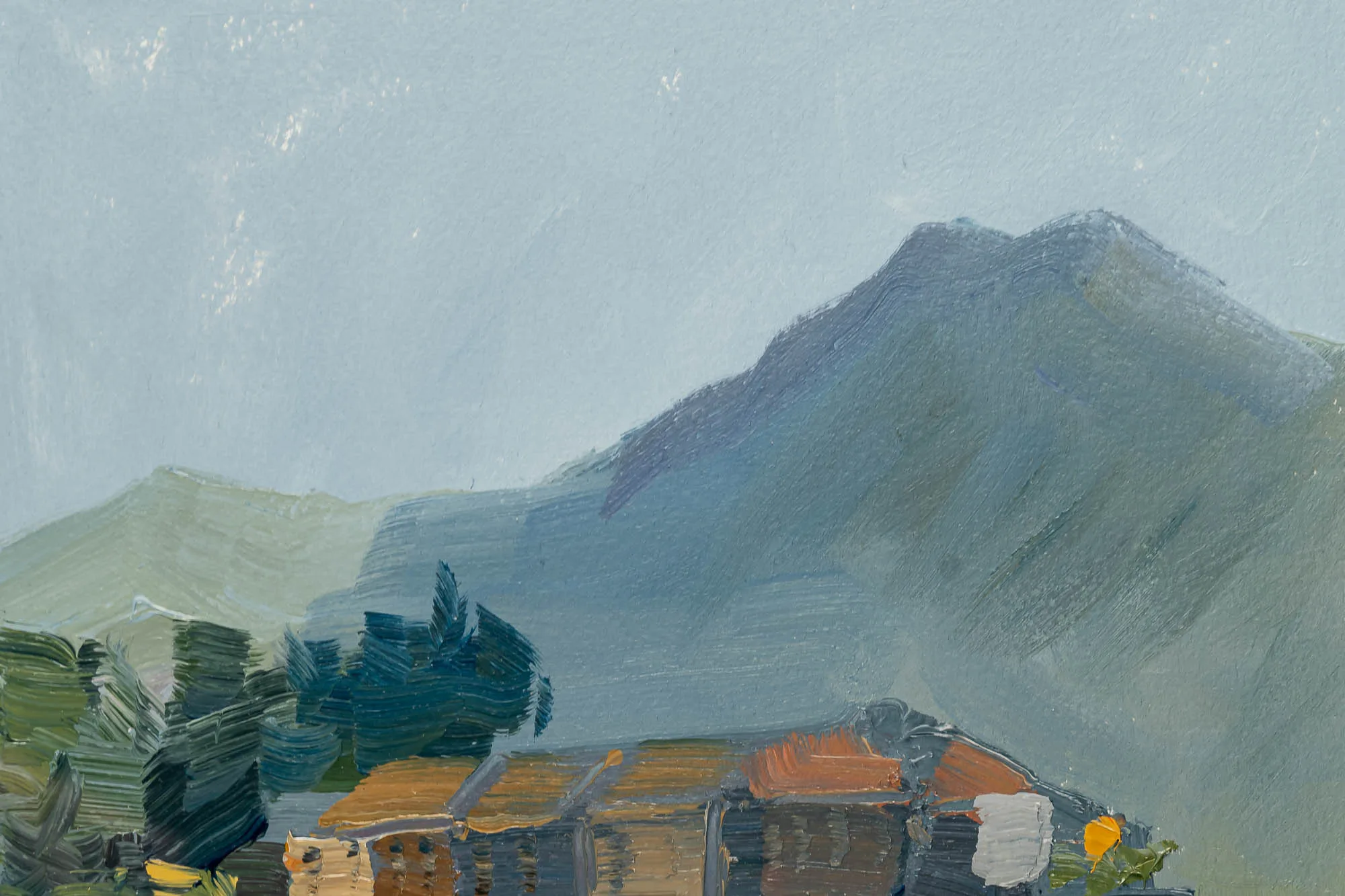 Close-up of Lakeside Tranquility, an original oil painting by Paul Kenton, showing rooftops in warm ochre and orange beneath hazy blue-grey mountains, with textured brushwork in muted tones.