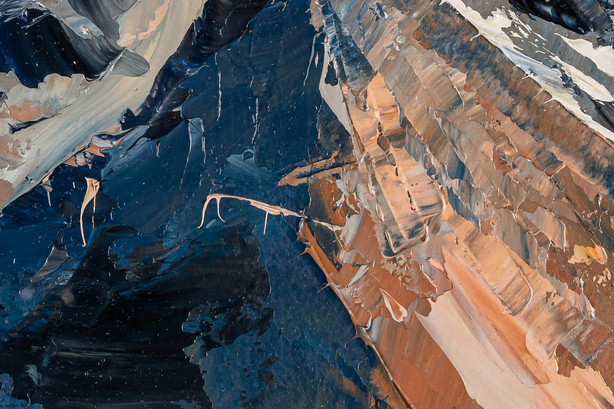 Close-up of Rugged Rhythms, an original oil painting by Paul Kenton, showing thick palette-knife ridges of deep navy and charcoal beside warm ochre, cream and rust, suggesting rocky Alpine slopes.