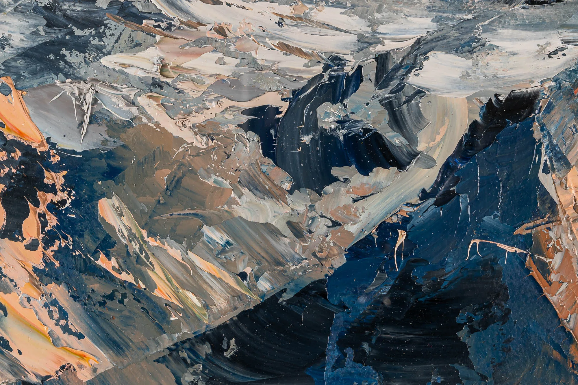Close-up of Rugged Rhythms, an original oil on paper painting by Paul Kenton: thick, palette-knife strokes of navy, slate grey, cream and peach build craggy, snow-streaked mountain forms.