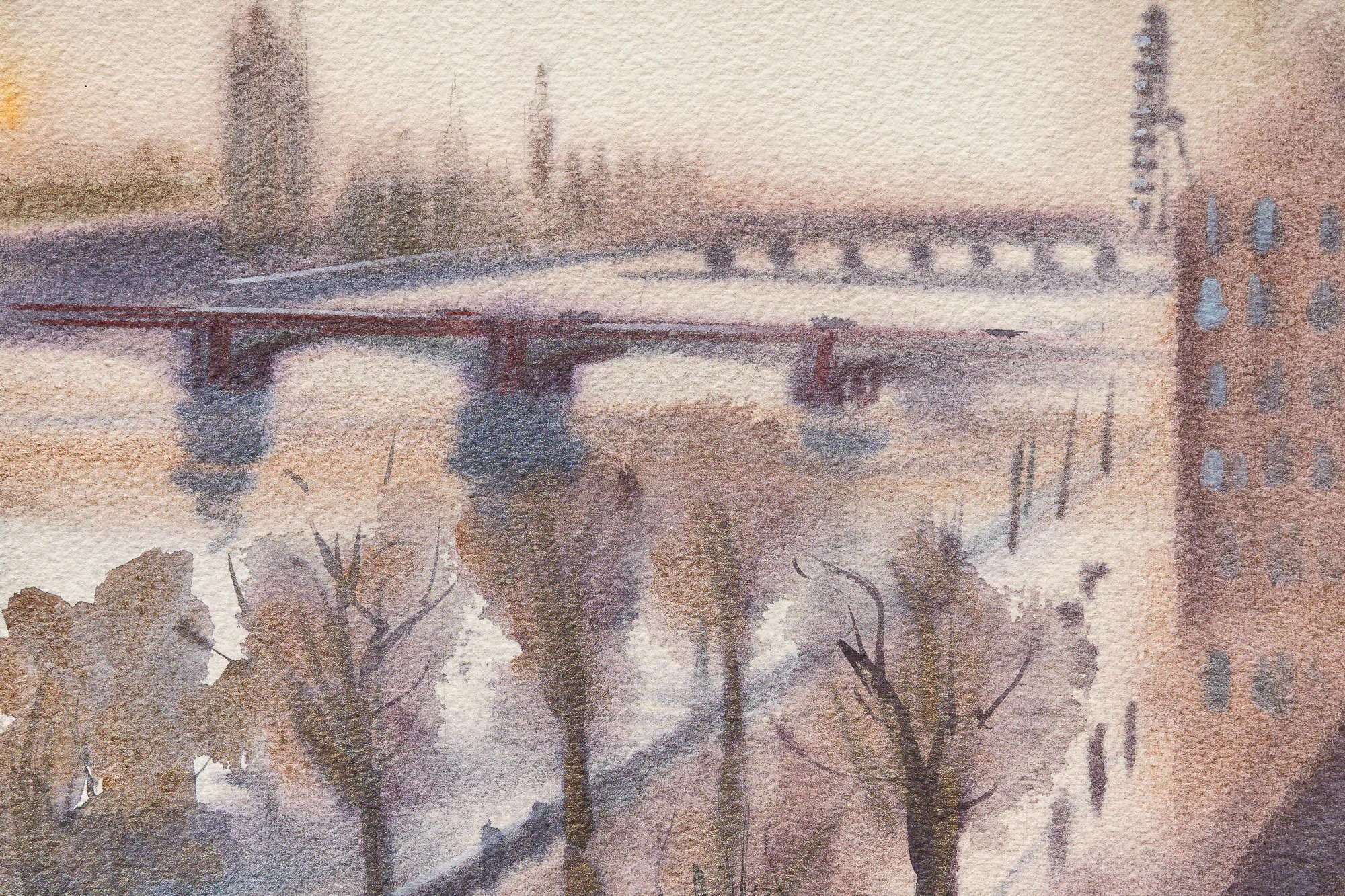 Close-up of London Haze, an original watercolour by Paul Kenton: a misty riverside with bare trees, a red-brown bridge and a brick building in soft lilac and ochre tones.