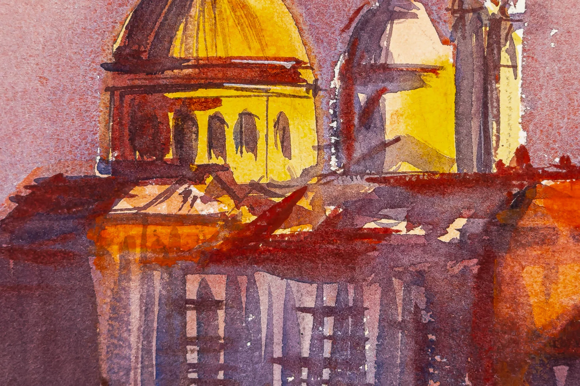 Close-up of Sunset Hues Over Venice, an original watercolour painting by Paul Kenton, showing a glowing golden dome and rooftops in loose, warm red and orange washes.