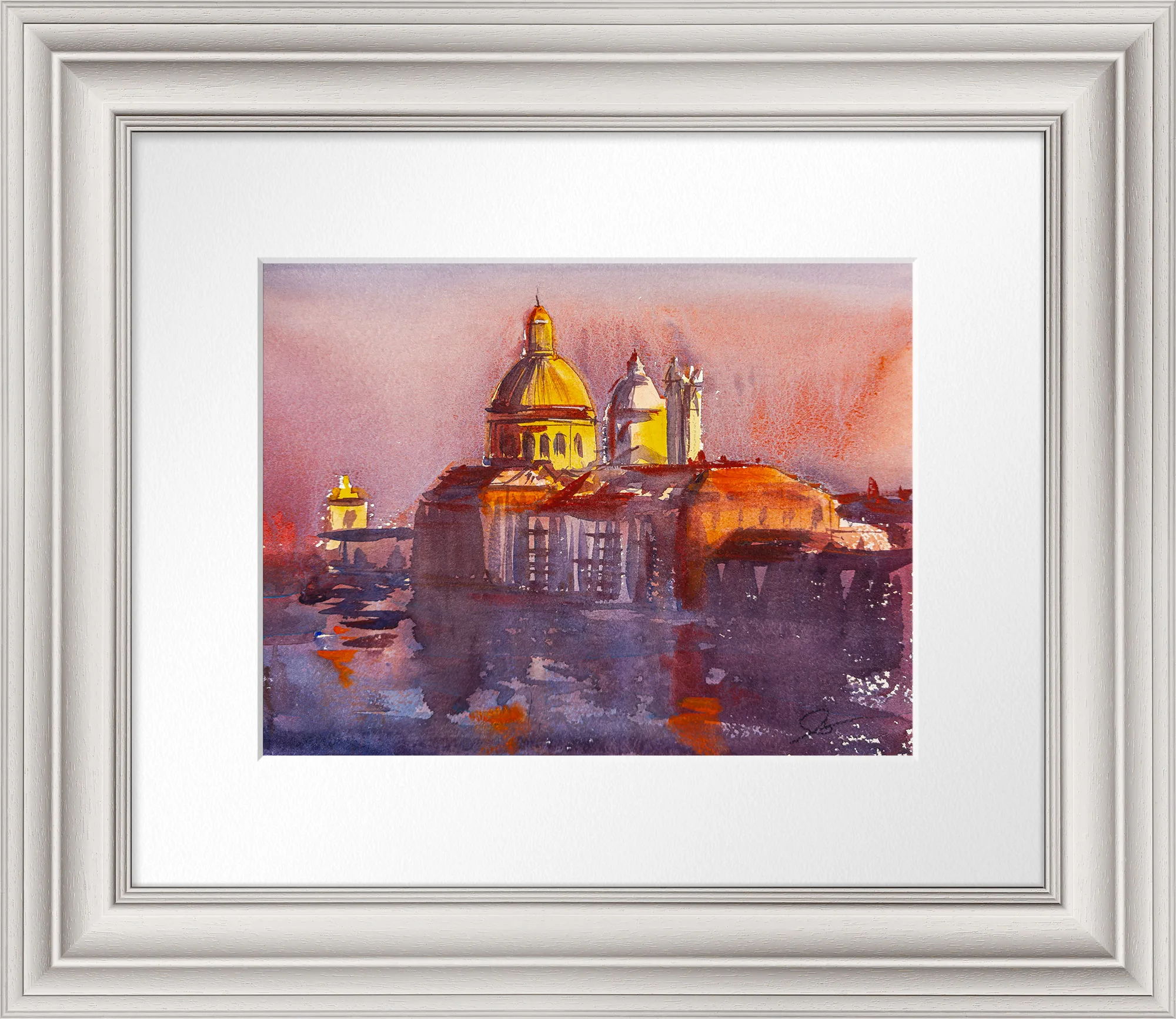 Sunset Hues Over Venice, an original watercolour painting by Paul Kenton, shown in a white ornate frame with a wide white mount: golden domes glow against warm pink and violet sky above Venetian rooftops.