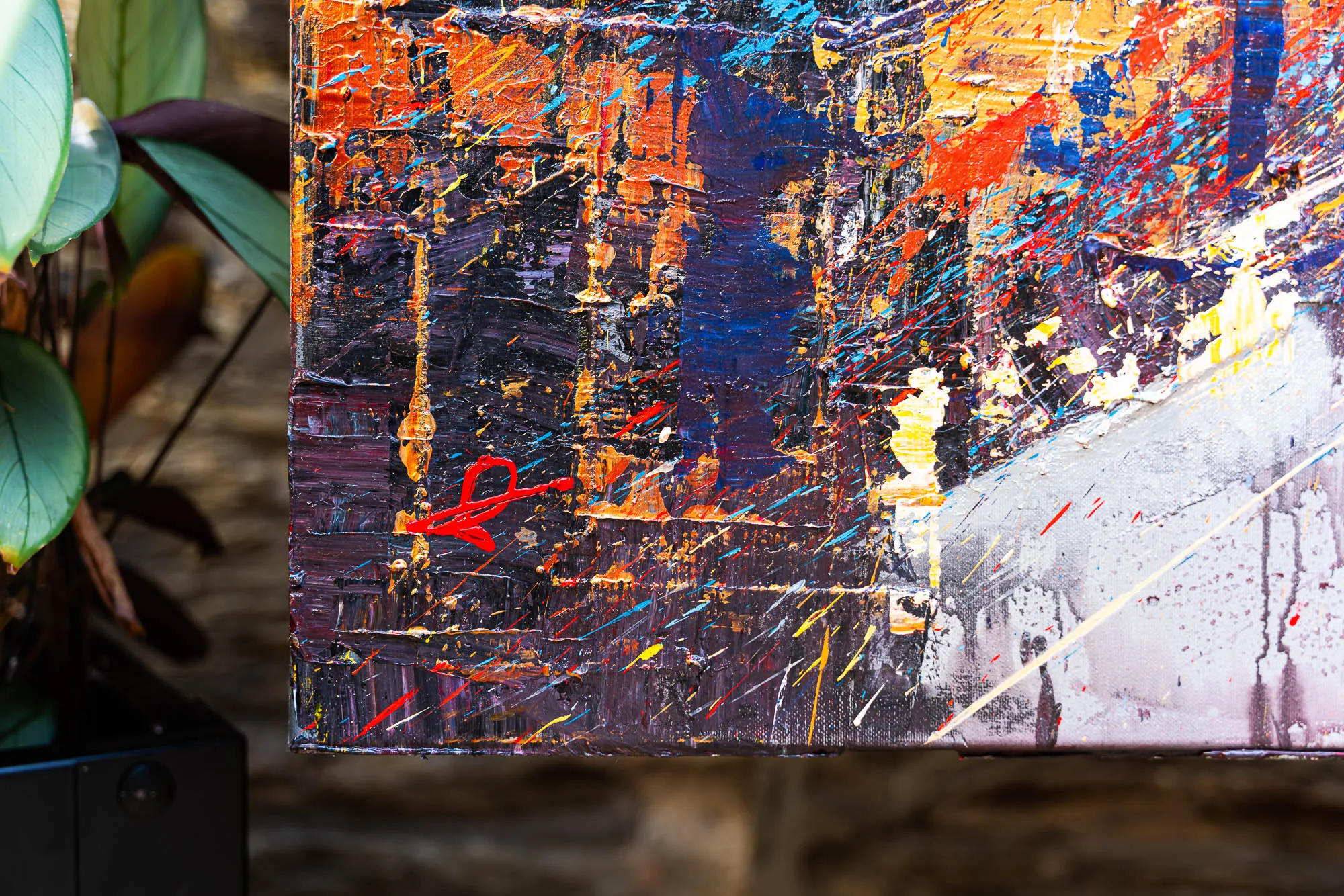 Close-up of Blaze Across the Thames, an original painting by Paul Kenton, showing thick textured paint in orange, deep blue and purple with flecks of red, yellow and silver across a city scene.
