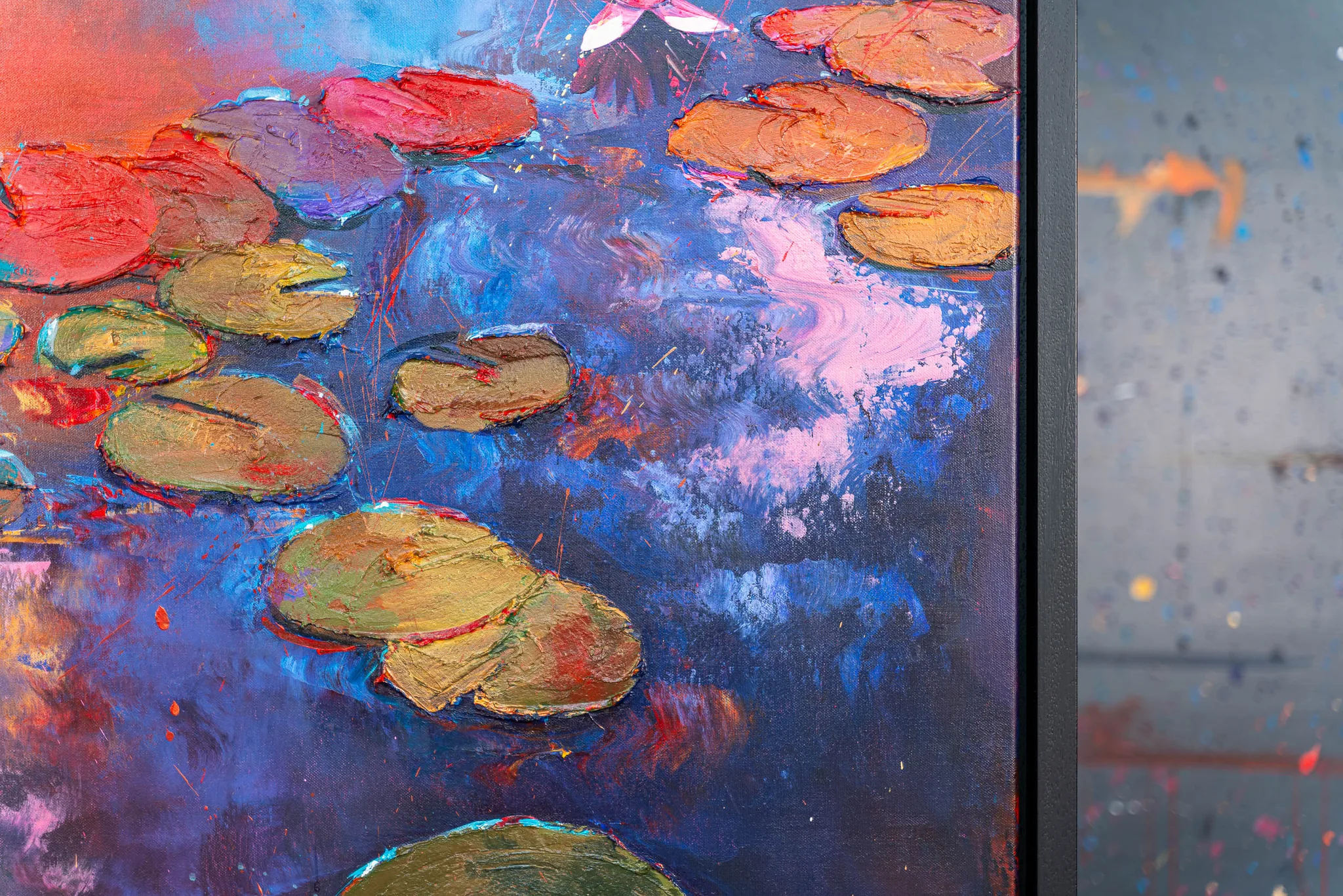 Close-up of Celestial Blooms, an original painting by Paul Kenton: thick, textured lily pads in red, ochre and olive float on deep blue water flecked with pink and violet brushwork.