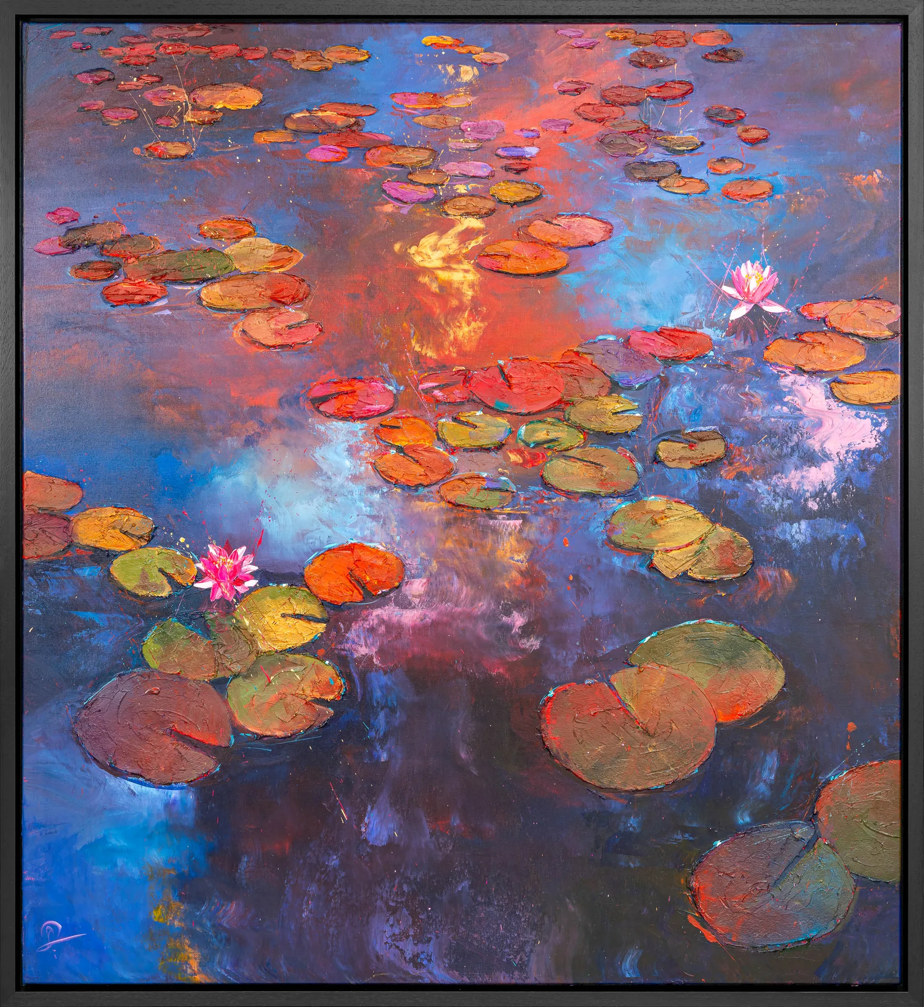 Celestial Blooms, an original painting by Paul Kenton in a slim black frame: water lily pads and two pink lotus blooms float on a pond reflecting a fiery orange and blue sky in thick, textured strokes.