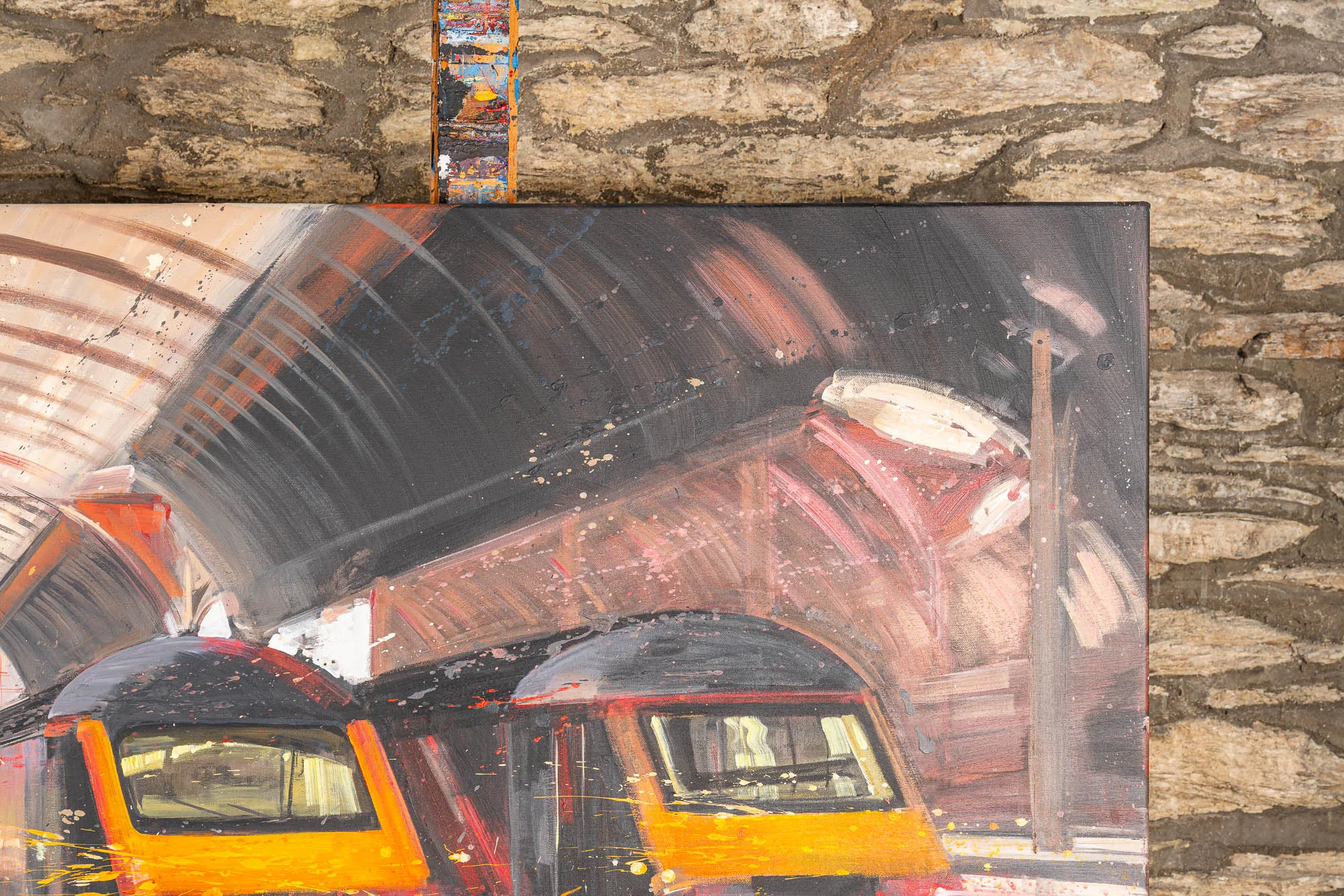 Close-up of Capital Connections, an original oil painting by Paul Kenton: sweeping, loose brushstrokes in grey, rust and cream form a tunnel-like roof above two orange-fronted train carriages.