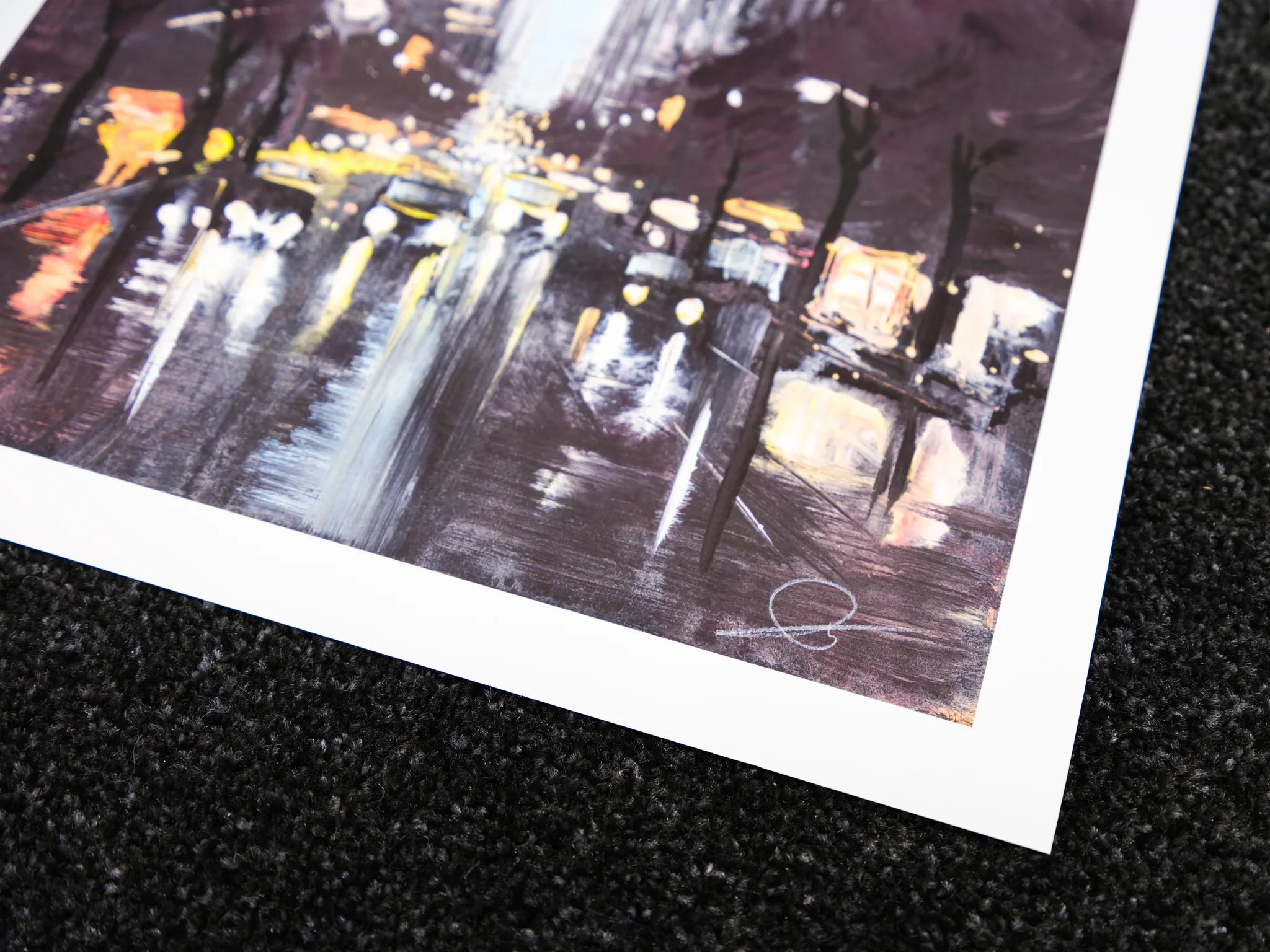 Close-up of the lower corner of Chrysler Shines, a limited edition print by Paul Kenton, showing a night street scene in New York with blurred yellow and white lights, wet dark reflections and loose, textured purple-brown brushwork.