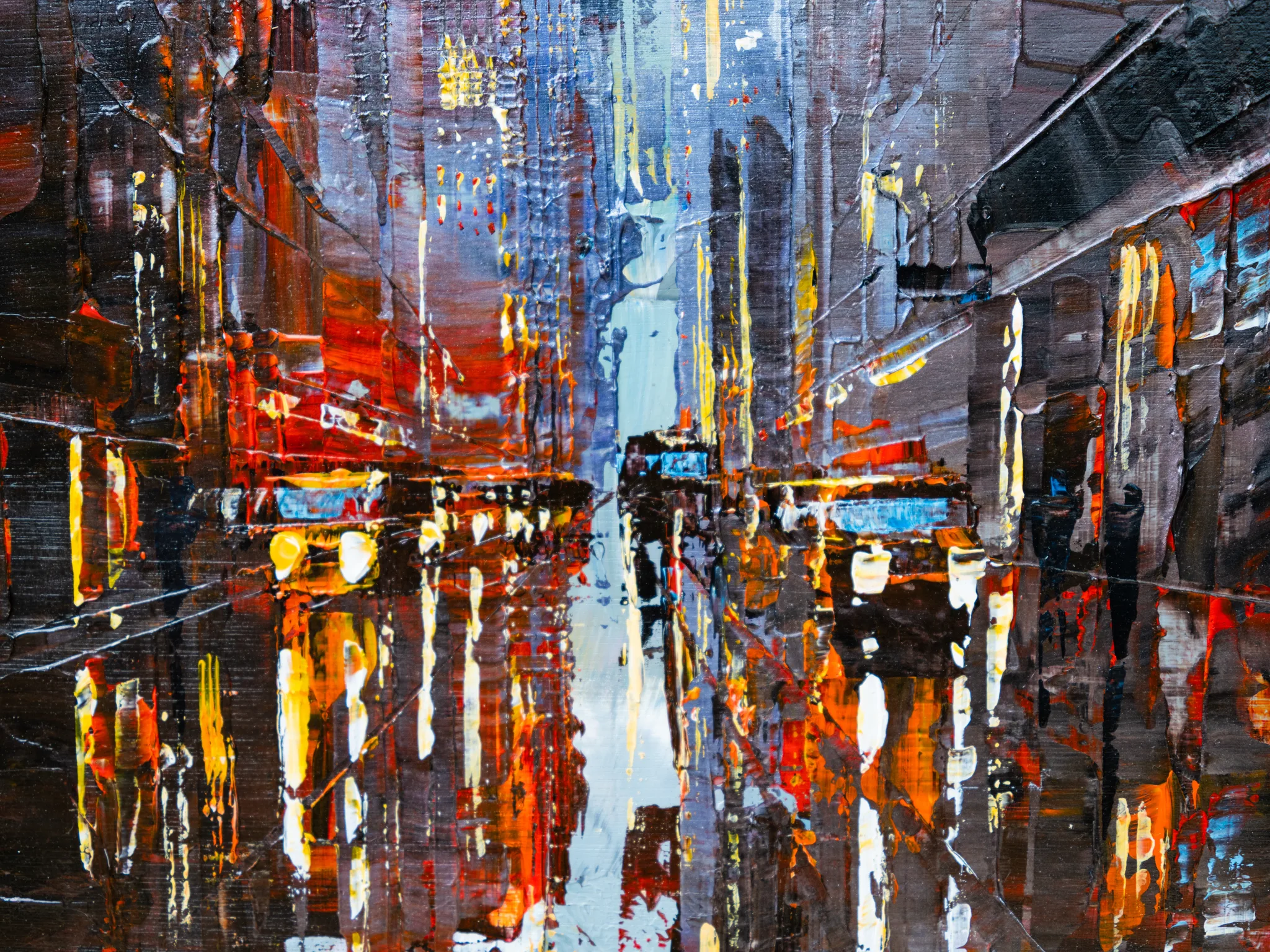 Detail of Dark Midtown, an original painting by Paul Kenton: thick palette-knife strokes of red, orange and gold lights reflected in a dark, wet city street, with a pale blue glow down the centre.