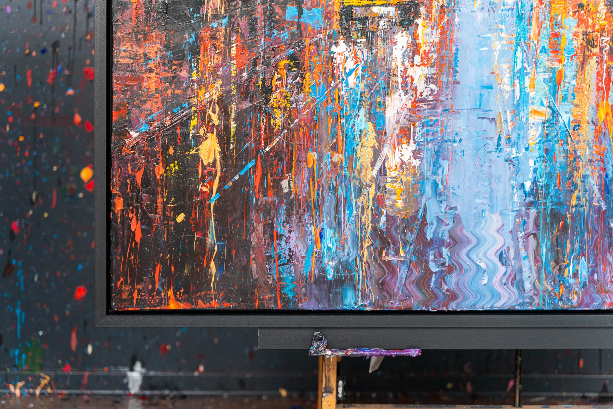 Close-up of Empire City Spectrum, an original painting by Paul Kenton: thick, dripping strokes of orange, blue and violet with metallic highlights, suggesting a city lit at night.
