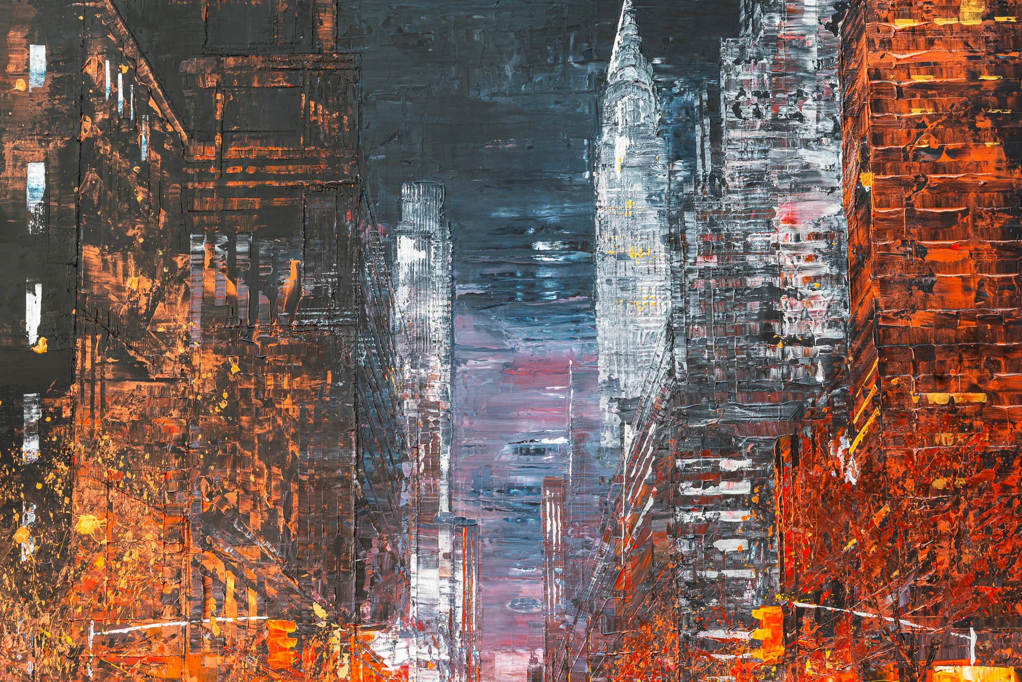 Close-up of Embers of the City, an original painting by Paul Kenton: thick, textured brushwork shows a New York street at dusk, with glowing orange facades framing a pale, stepped skyscraper beneath a dark blue sky.