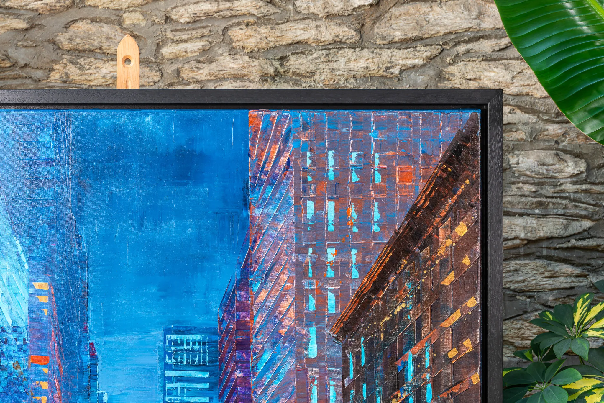 Close-up of Feeling Groovy, an original painting by Paul Kenton: textured blue sky between towering New York buildings, with brick facades in rust and copper tones dotted with glowing turquoise windows.