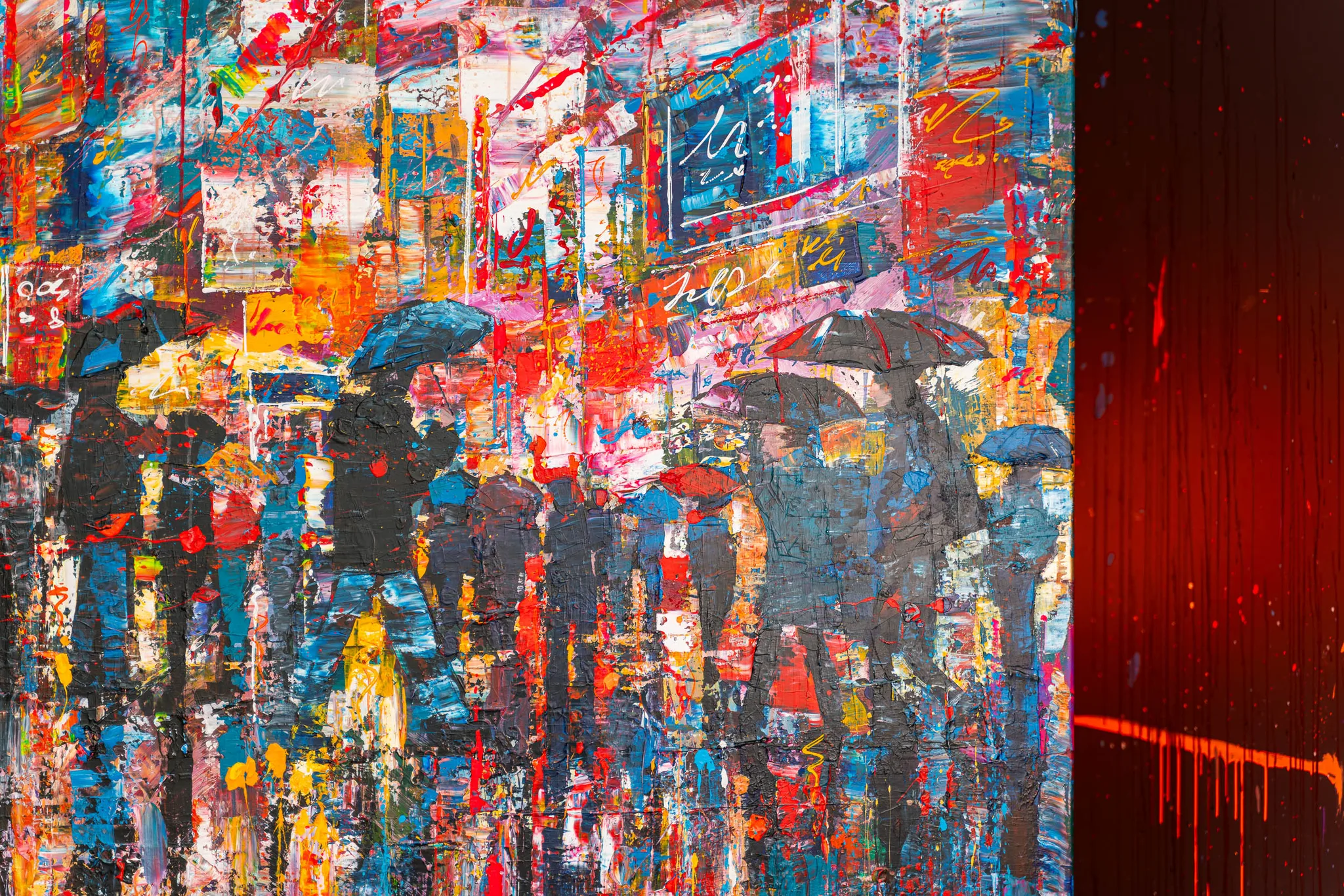 Close-up of Fairytale Of New York, an original mixed media painting by Paul Kenton: umbrellas and dark figures crossing a street of bold red, blue and yellow neon-lit paint, with thick textured brushwork.