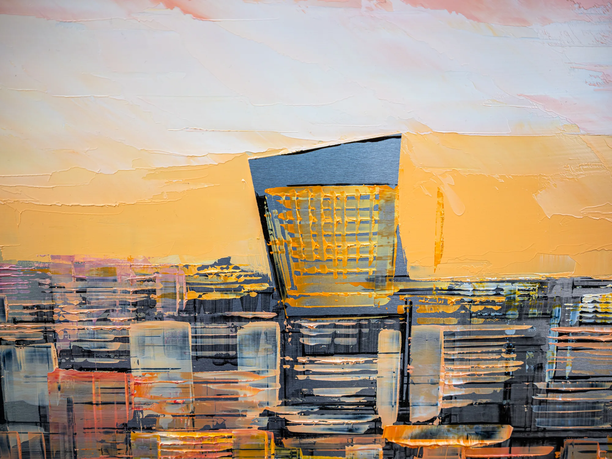 Close-up detail of Golden Capital, an original painting by Paul Kenton: a thick-textured London skyline at sunset, with a dark tower glowing amber and gold against pale sky and grey blocks.
