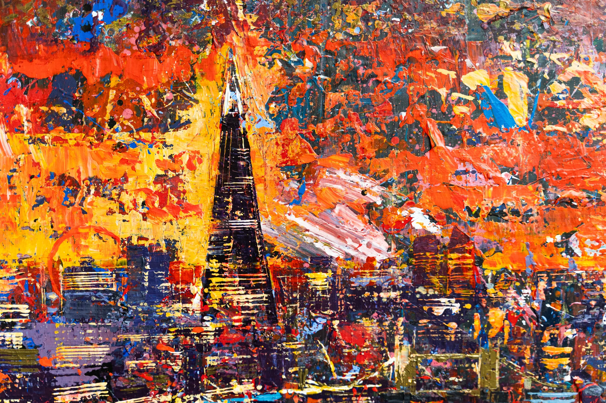 Close-up of London in Motion, an original mixed media painting by Paul Kenton, showing thick orange, red and gold impasto strokes around a tall dark spire rising over a glowing city skyline.
