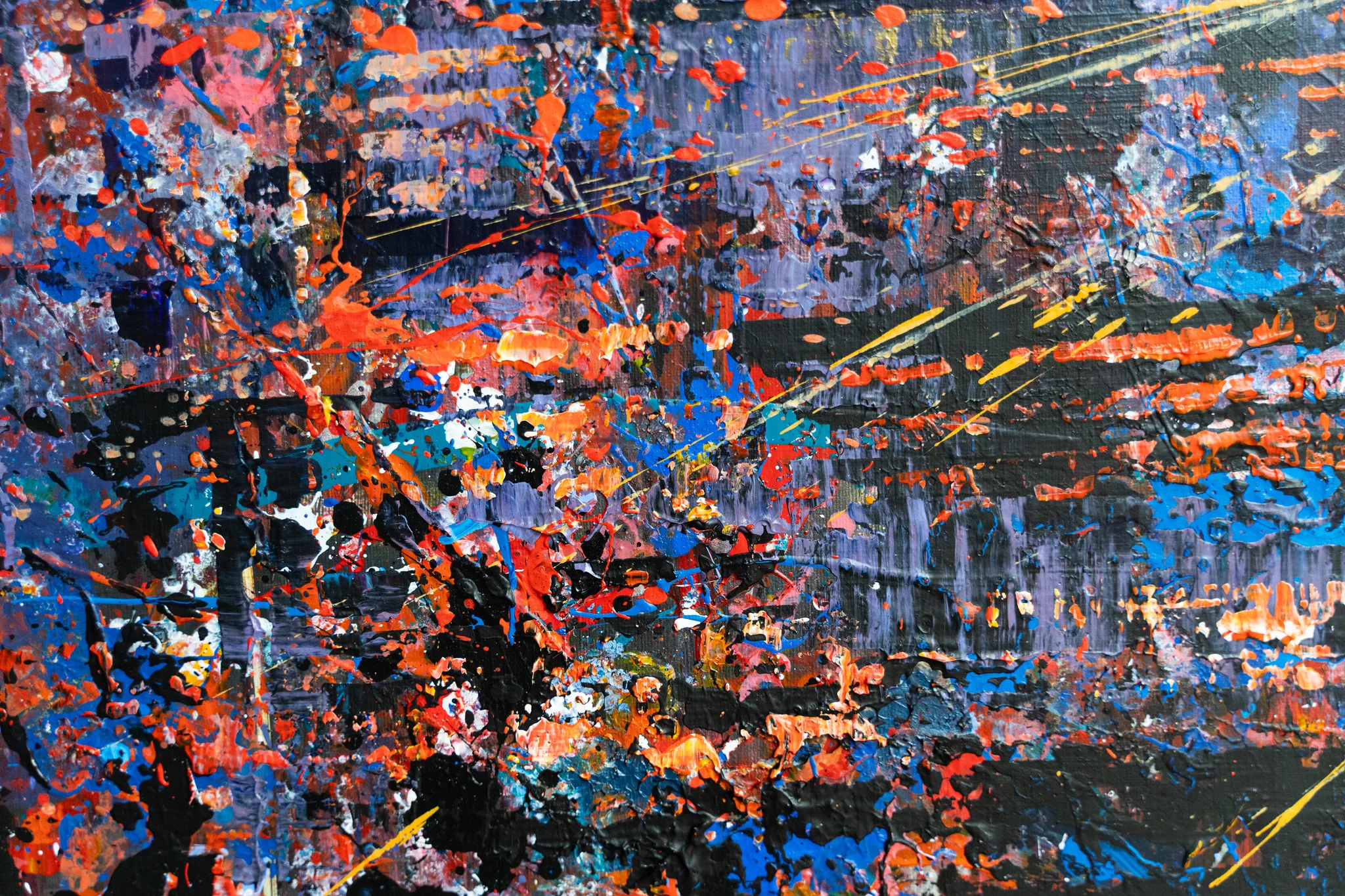 Close-up of London in Motion, an original mixed media painting by Paul Kenton, showing thick orange, blue and black paint splatters, with streaks of yellow suggesting traffic lights and movement.