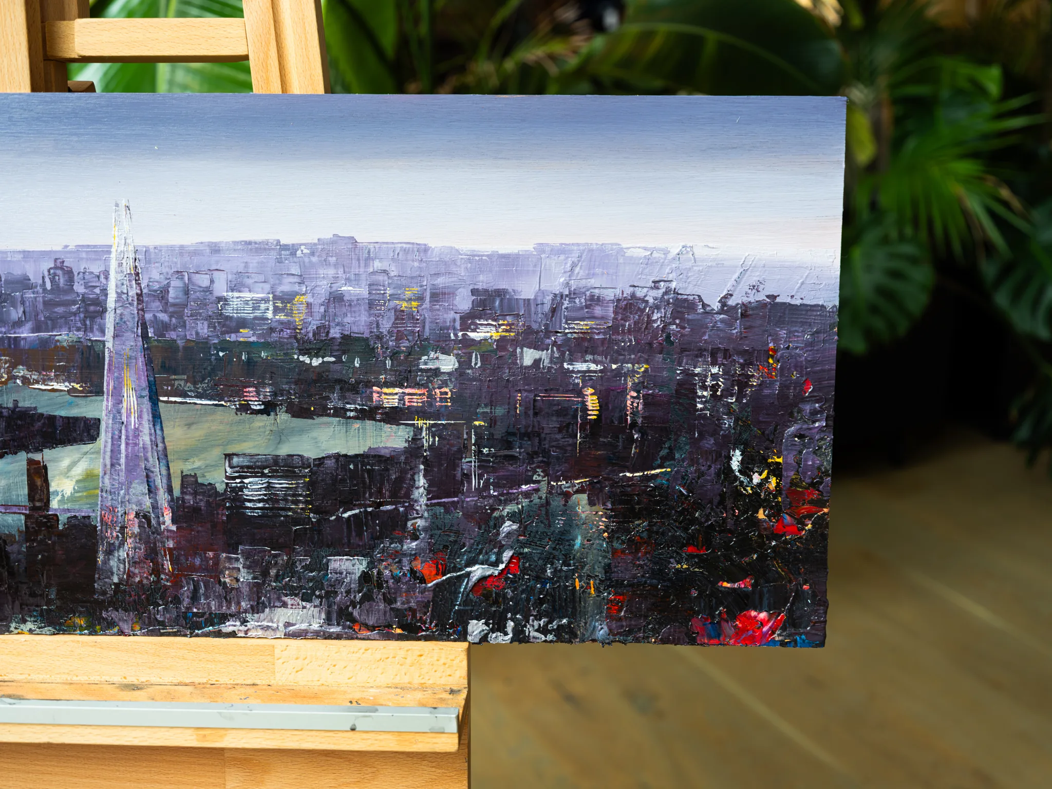 Close-up of London Nocturne, an original mixed media painting by Paul Kenton, showing thick purple and charcoal brushwork of a London skyline at dusk, with the Shard's tapering spire on the left and touches of red and gold light.