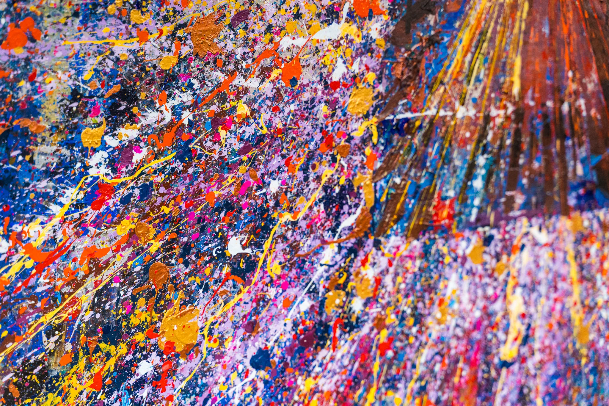 Close-up of Manhattan Burst, an original painting by Paul Kenton: dense splashes and drips of orange, yellow, violet, blue and white paint, with rust-brown streaks and metallic gleams on the right.