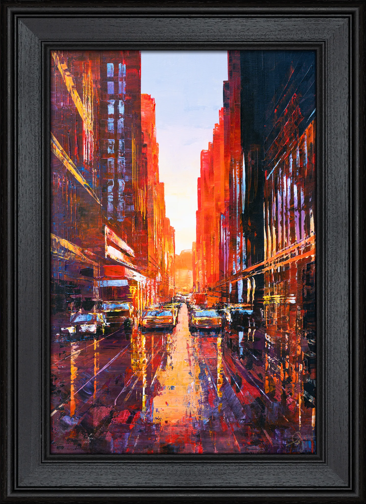 Manhattan Heat, an original painting by Paul Kenton in a black wood frame: a sunlit New York street at dusk, with glowing orange and red buildings, wet reflections and yellow taxis.