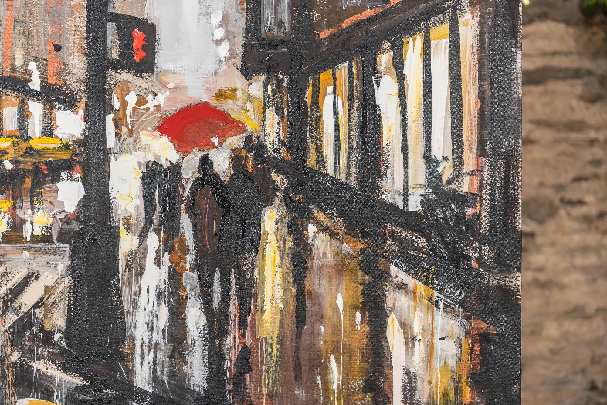 Close-up of Manhattan Showers, a painting of a rain-soaked city street with a red umbrella among dark silhouetted pedestrians, thick black brushstrokes and drips, and glowing yellow and white window lights reflected on the wet pavement.