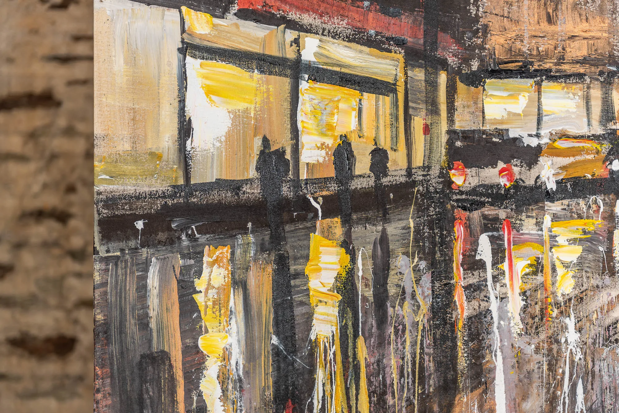 Close-up of Manhattan Showers: thick, textured brushstrokes of yellow, ochre and white glow in dark silhouetted shopfronts, with black figures on a wet street, red accents and dripping paint.