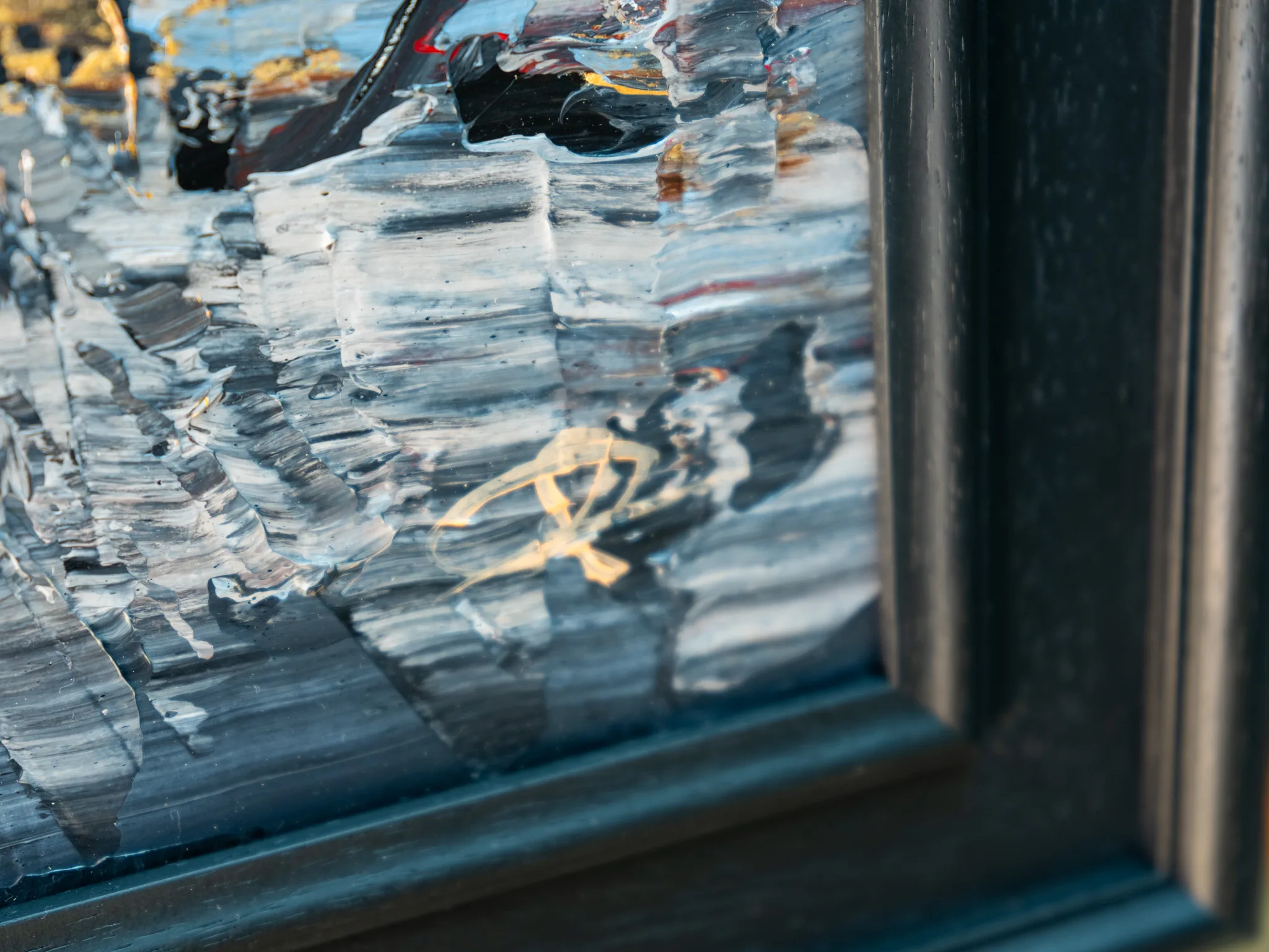 Close-up of Midtown Silver, an original mixed media painting by Paul Kenton, showing thick grey and white palette-knife strokes, gold metallic flecks and a dark frame edge.