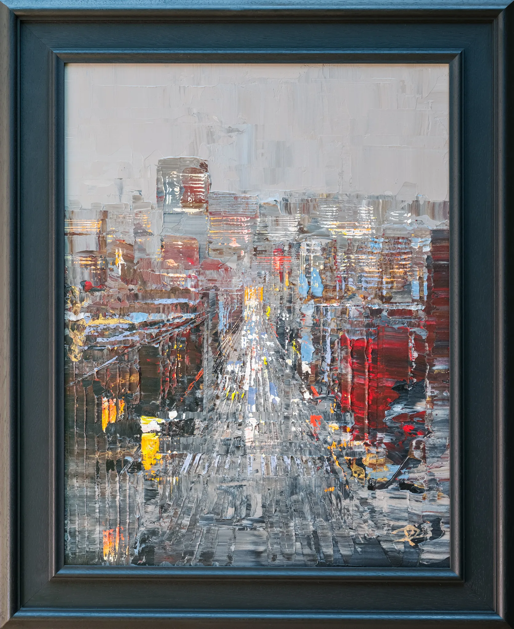 Midtown Silver, an original painting by Paul Kenton in a dark blue-black frame: a textured, palette-knife street scene of New York at dusk, with silver-grey tones, glowing windows and red building facades.