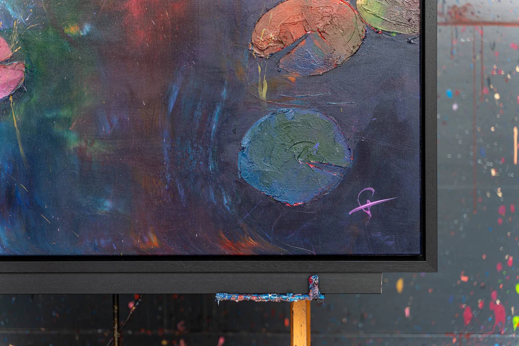 Close-up of Nocturne Blossoms, an original painting by Paul Kenton, showing thick textured lily pads in teal and coral on a dark blue-violet water surface, framed in black.