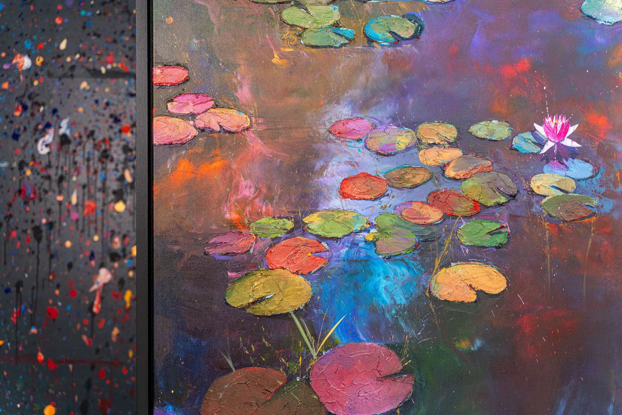 Close-up of Nocturne Blossoms, an original painting by Paul Kenton: thickly textured lily pads in pink, orange and green float on a dark, shimmering pond, with a pink water lily at upper right.