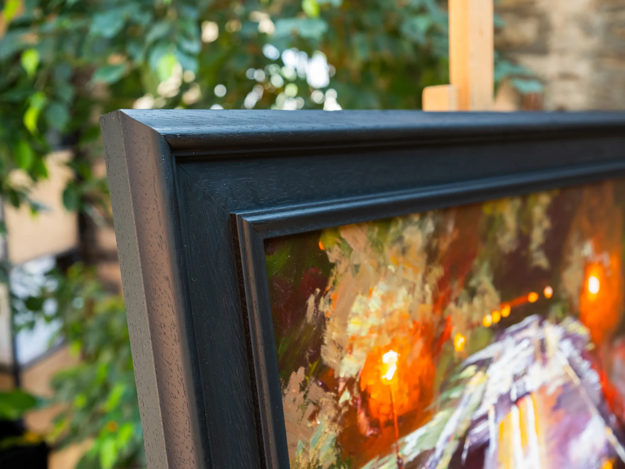 Close-up of Night Drive, an original painting by Paul Kenton, showing thick textured brushwork of glowing orange lights and deep purple shadows in a black frame.