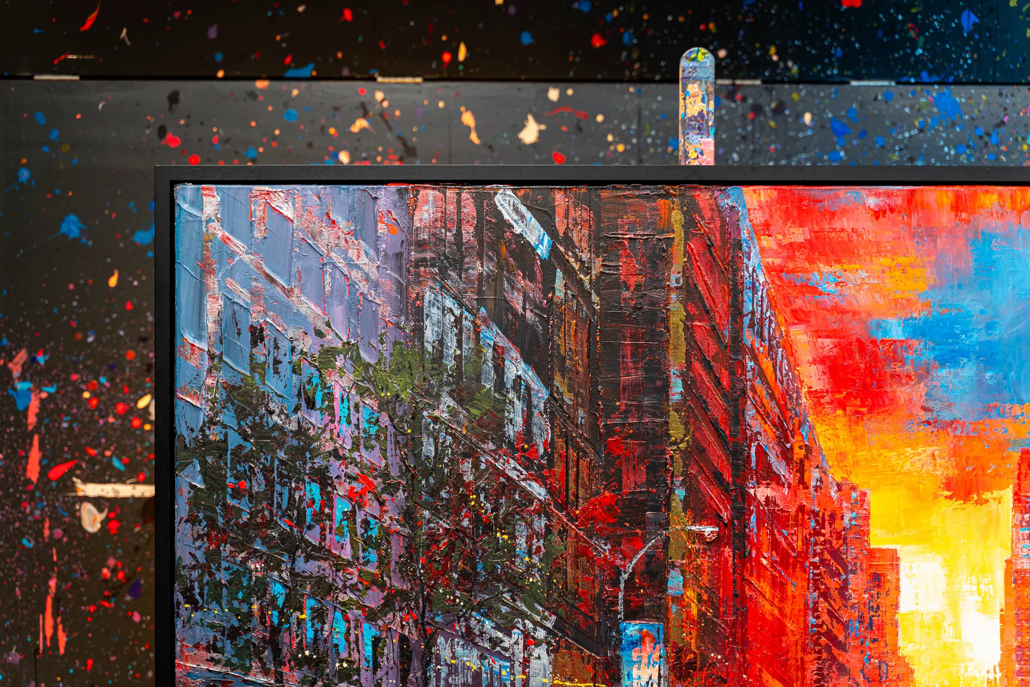 Close-up of NY Ablaze, an original painting by Paul Kenton: thick, textured brushwork on a New York street, with cool lilac buildings on the left giving way to fiery red and orange sunset sky on the right.