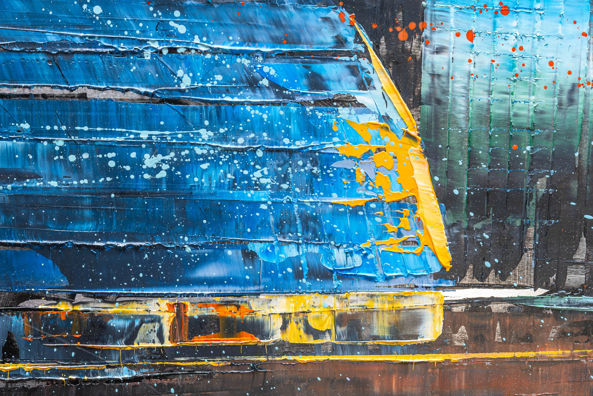 Close-up of Panoramic Glow, an original painting by Paul Kenton: thick blue and yellow impasto strokes with white and orange paint spatter over dark bands, showing the textured surface.
