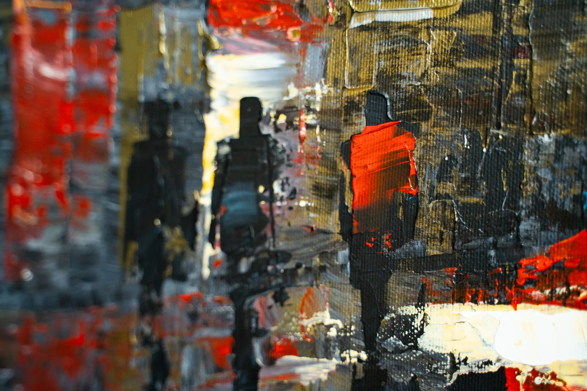 Close-up of Street in Yellow, an original painting by Paul Kenton: thick palette-knife strokes of red, gold and black show dark figures walking down a city street.