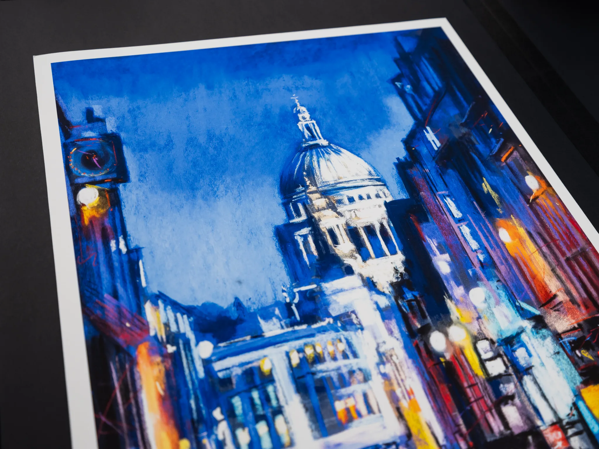 Close-up of St Paul's Star, a limited edition giclée print by Paul Kenton: St Paul's Cathedral's dome glows under deep blue sky, with warm street lights in the textured foreground.