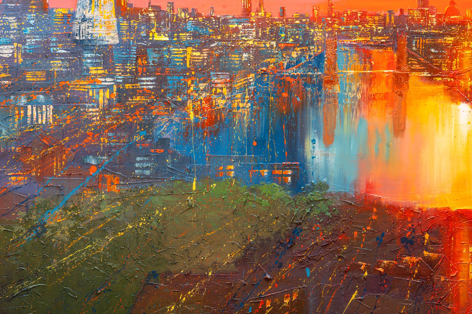 Close-up of Skyline Radiance, an original painting by Paul Kenton: thick, textured strokes of orange, blue and gold show a city skyline at dusk, with a green and brown foreground.