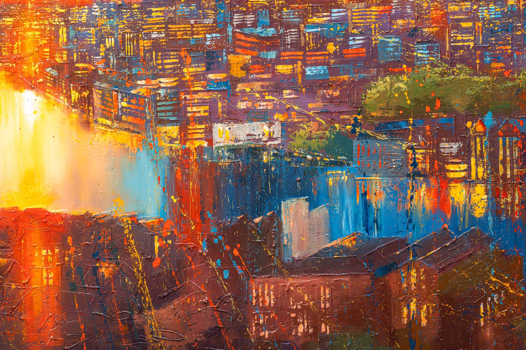 Close-up of Skyline Radiance, an original painting by Paul Kenton, showing thick textured brushwork of a dense city of rooftops and windows glowing in warm orange, gold and blue light.
