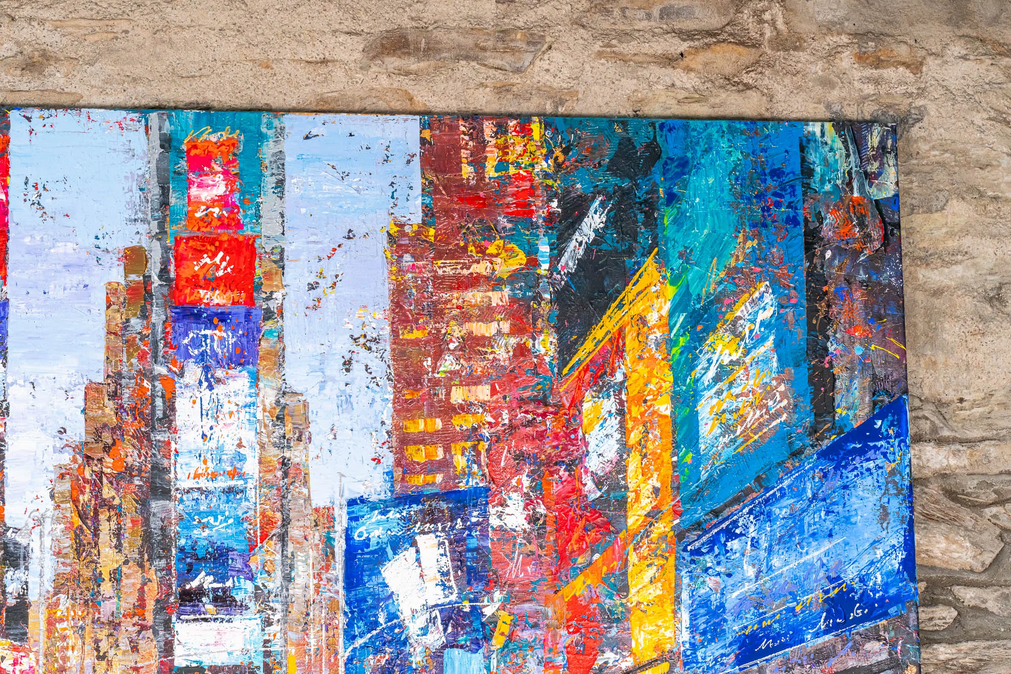 Close-up of Steps Through Times Square, an original painting by Paul Kenton, showing thick, textured bands of red, blue, orange and turquoise over skyscrapers and glowing signs.