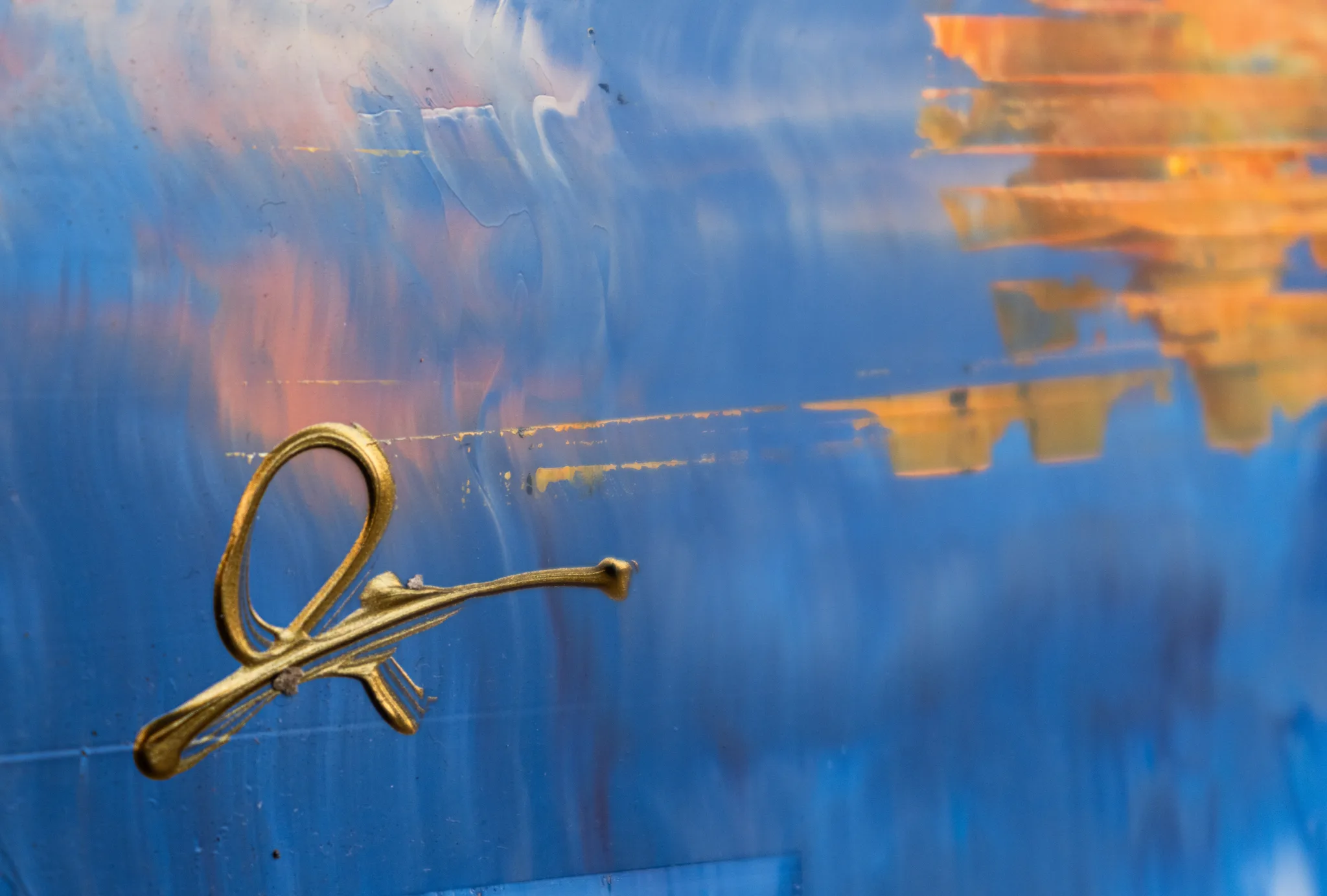 Close-up of Thames in Texture, an original oil painting by Paul Kenton: a gold ankh-like loop sits on bold blue brushwork, with orange reflections streaking across the right.
