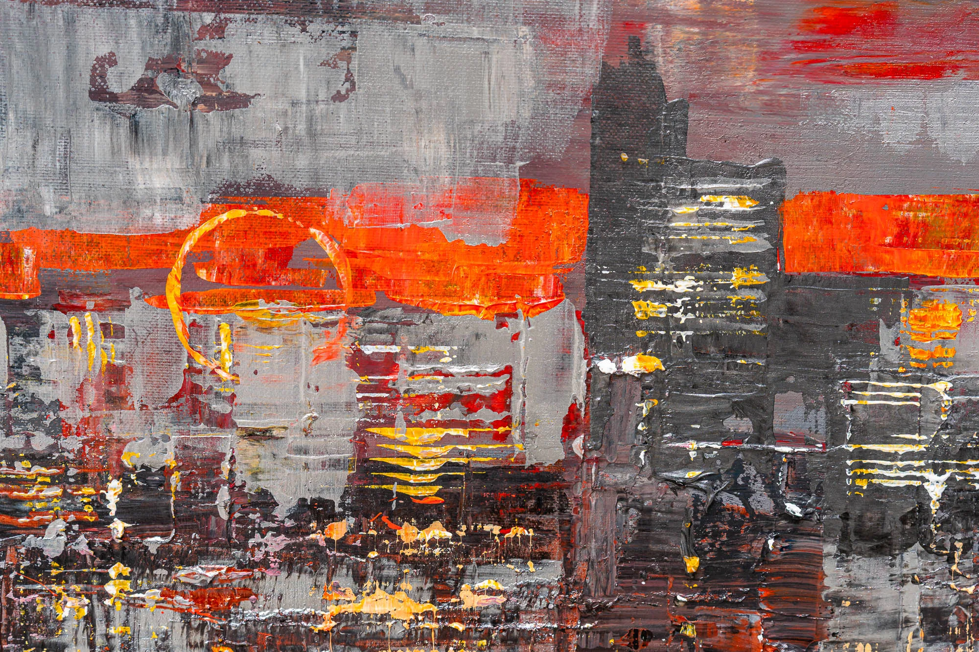 Close-up of Urban Alchemy, an original painting by Paul Kenton, showing thick textured strokes of orange, red and gold over grey and black towers at dusk.