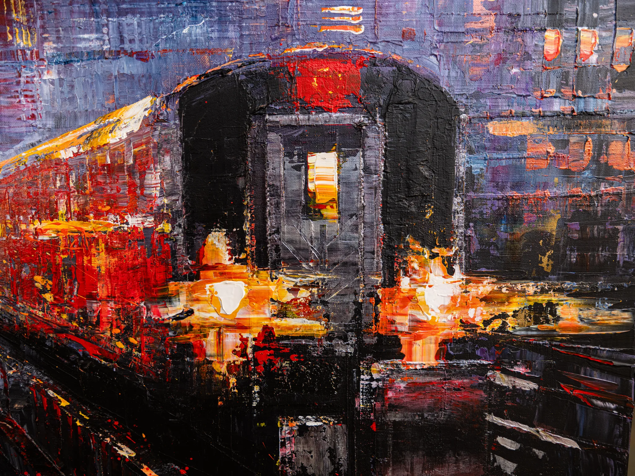 Close-up of Urban Approach, an original painting by Paul Kenton: thick, textured brushwork shows a dark subway train front with a glowing red carriage and warm yellow lights against violet city tones.