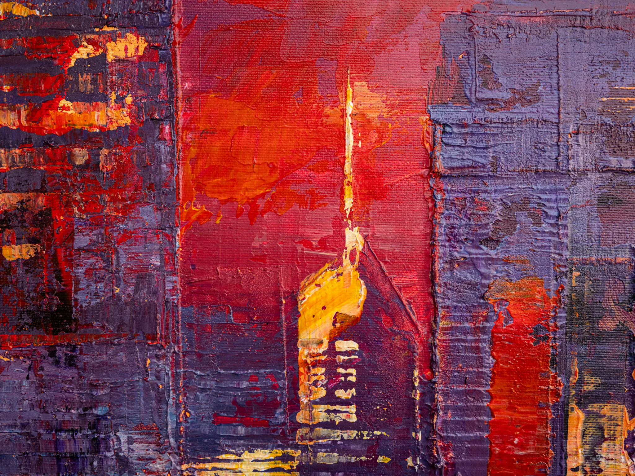 Close-up detail of Urban Approach, an original painting by Paul Kenton: thick, textured red and violet brushwork forms city buildings, with a glowing gold spire rising against a fiery sky.
