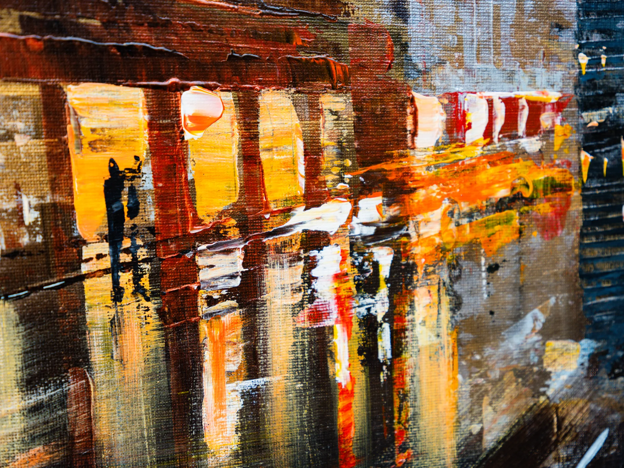 Close-up of Under the Chrysler, an original painting by Paul Kenton, showing thick textured brushwork in amber, red and orange, with a small dark figure on a reflective street at dusk.