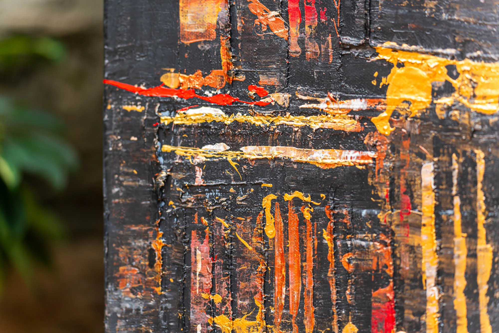 Close-up of Westminster Watch, an original painting by Paul Kenton, showing thick textured layers of black, with bold red, orange and gold strokes and drips of metallic paint.
