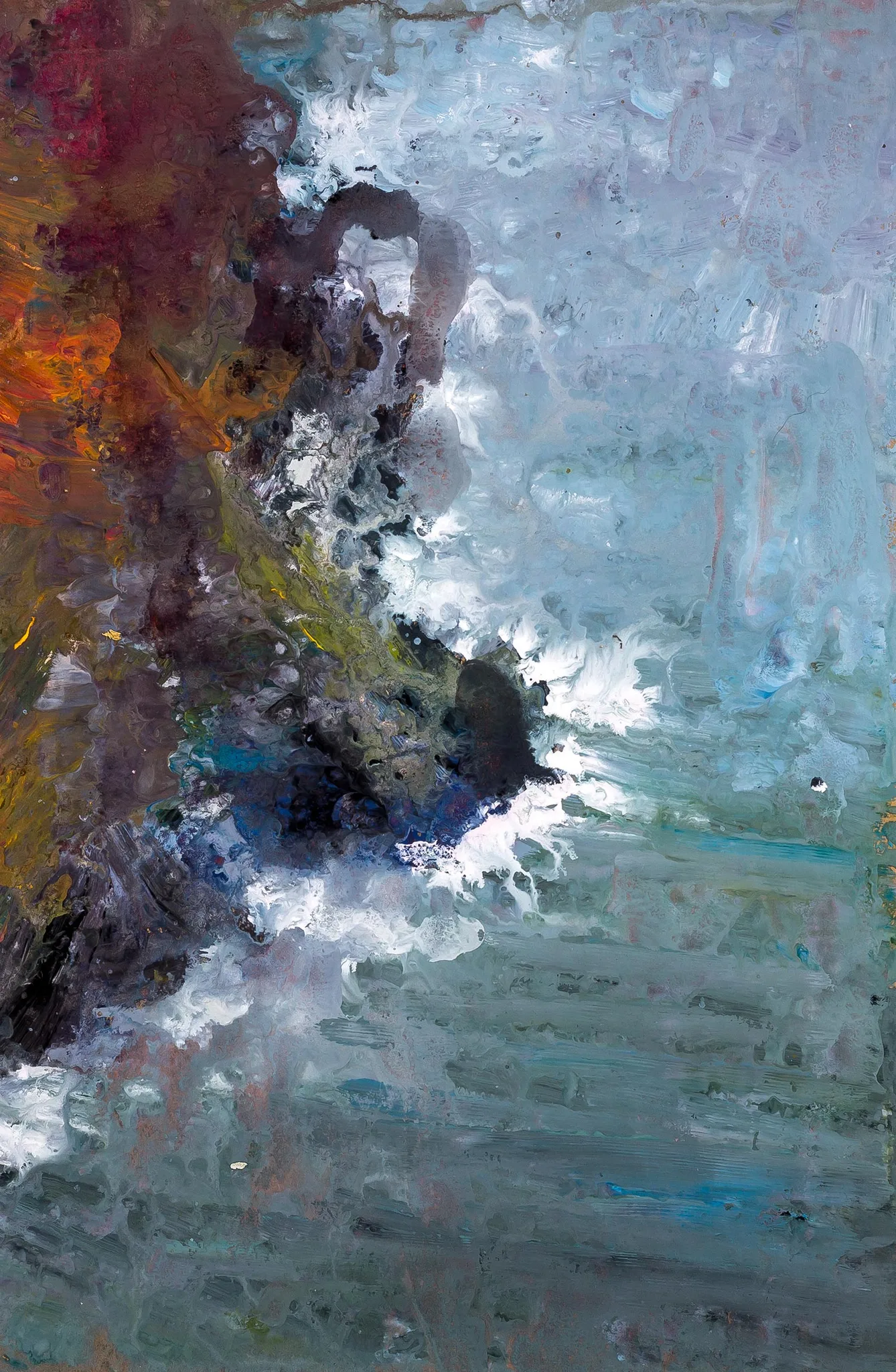 Against the Elements, an original gouache painting by Paul Kenton, shown in a textured silver frame with a wide white mount. Dark red and ochre rocks on the left meet white sea spray and muted blue-grey water.