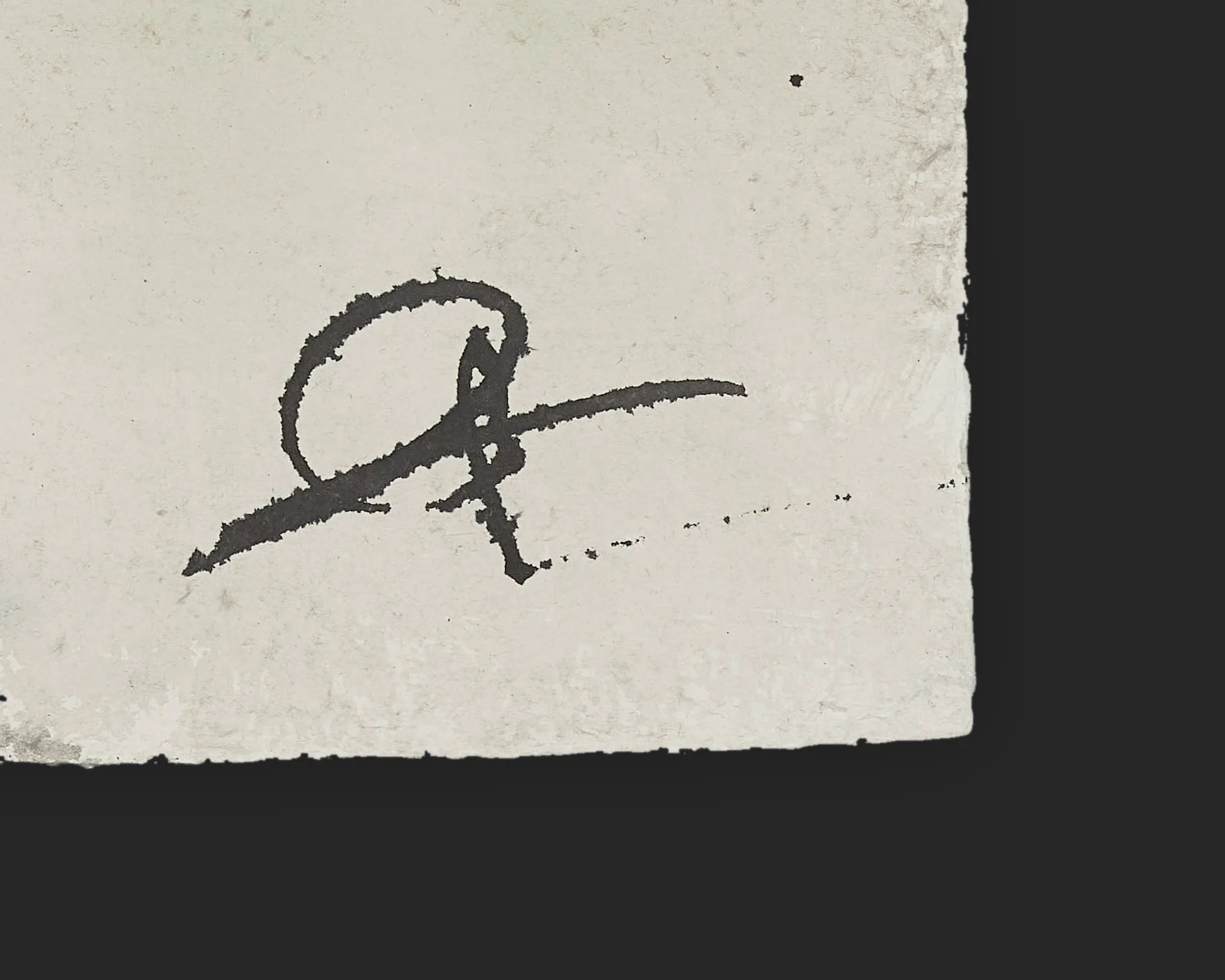 Close-up of the artist's dark ink signature in the lower corner of Fifth Avenue Haze, an original painting on Indian paper, with its ragged deckle edge visible.