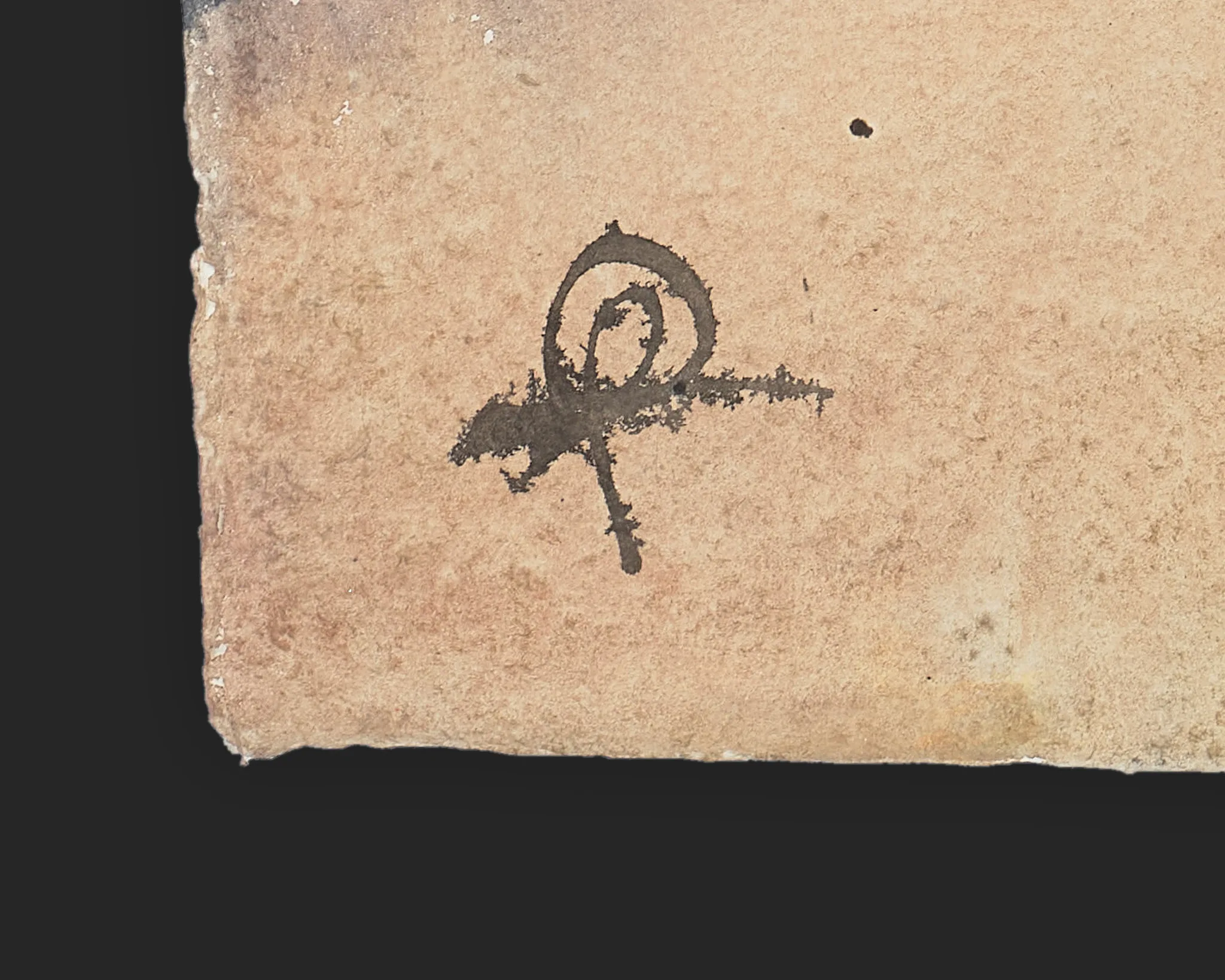 Close-up of the artist's dark brown ink signature in the lower corner of First Light Steps, an original painting on textured, deckle-edged Indian paper, set against a black background.