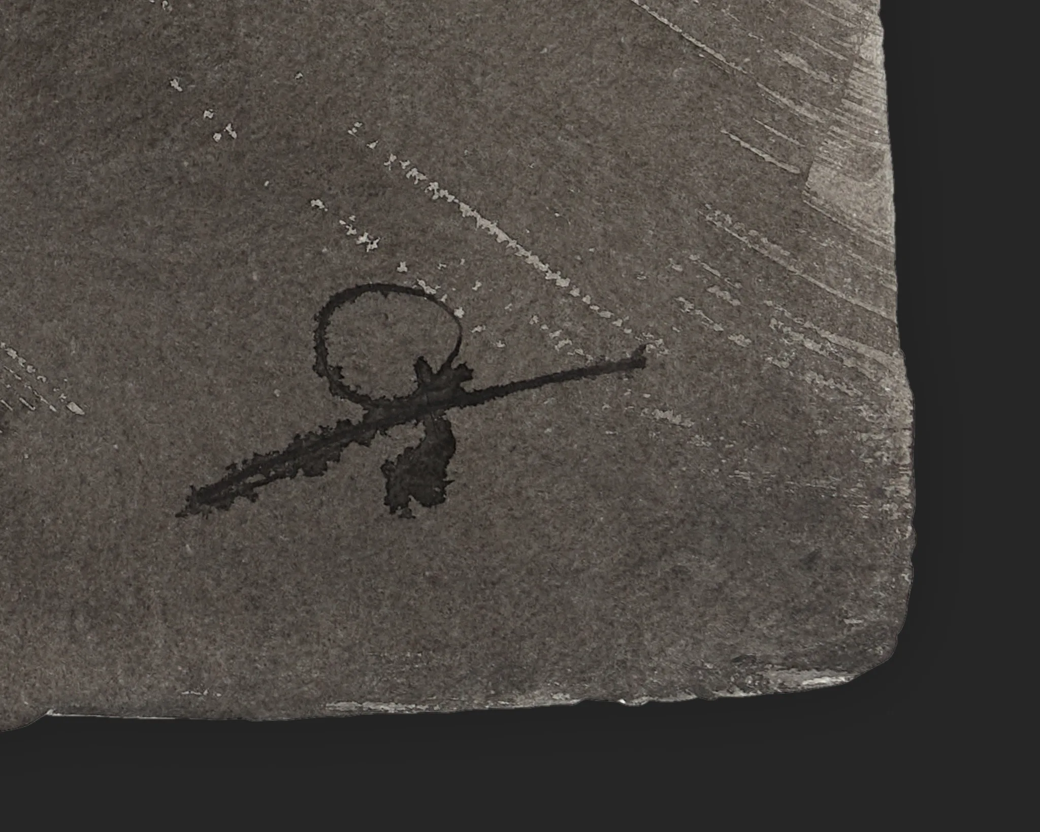 Close-up detail of Paul Kenton's ink signature in the lower corner of Borough Bound, an original painting on Indian paper, with grey textured paper and faint marks.
