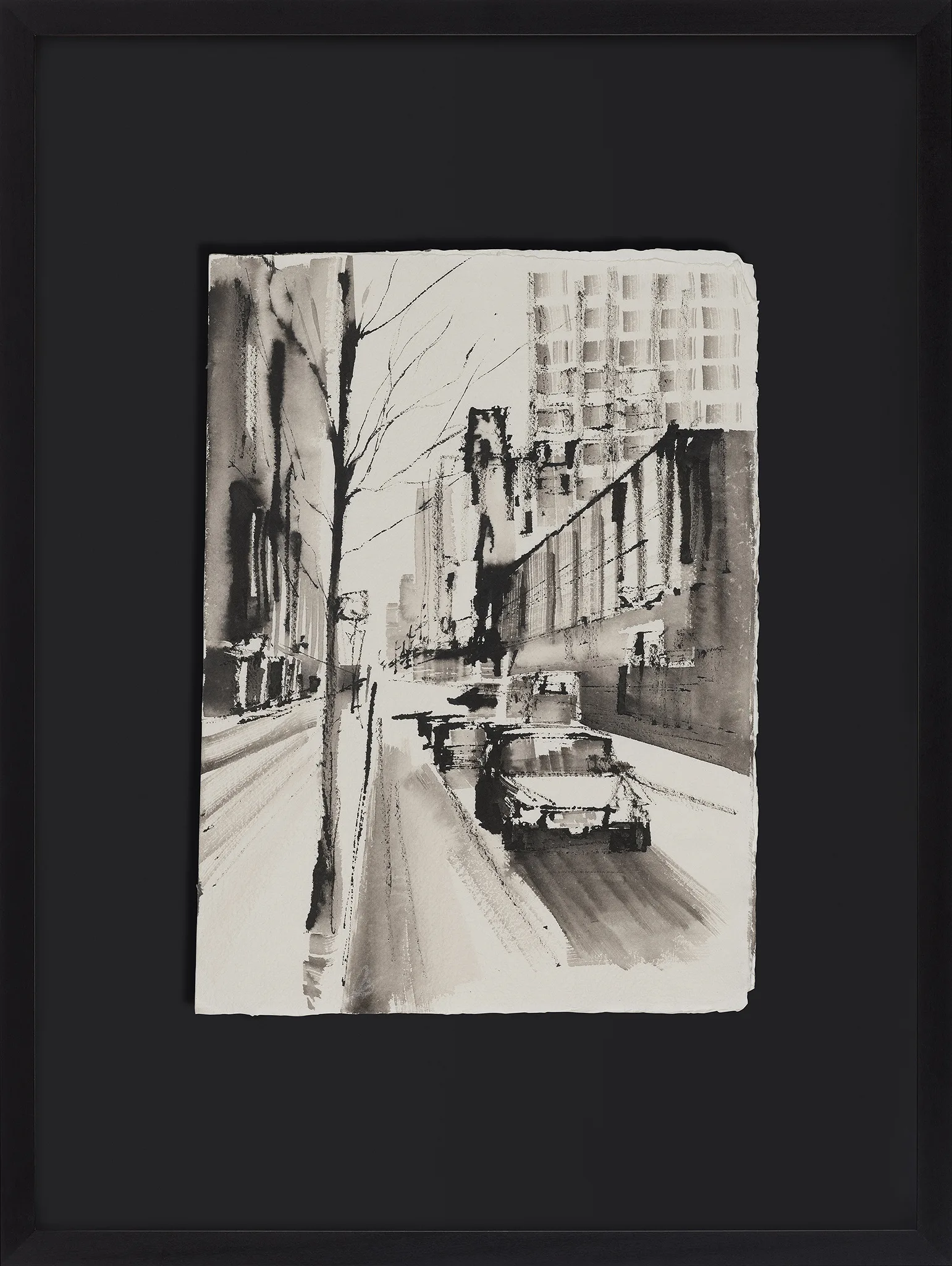 Monochrome Manhattan, an original ink painting by Paul Kenton, shown in a black frame with a wide black mount: a grey street scene of a bare tree, parked cars and tall buildings.